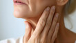 © Lin_Studio - Beautiful middle-aged woman touches the soft smooth skin on her neck