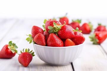 Sticker - Beautiful, fresh, delicious heaps of fresh strawberries in a ceramic bowl on a rustic white wooden background