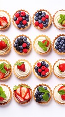Wall Mural - Beautiful set of delicious sweet tartlets with fresh berries on a white background, top view. Banner design, vertical photo