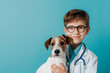 cute kid veterinary with a dog, isolated on blue background