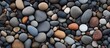 Smooth round pebbles texture background Pebble sea beach close up dark wet pebble and gray dry pebble High quality photo. Creative Banner. Copyspace image