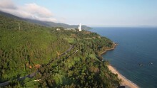 Aerial View Of A Coastal Forest Landscape Near Da Nang, Vietnam, Showcasing Serene Beaches And A Hilltop Structure, Recorded On February 10, 2024