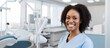 Portrait of Female black dentist in dental office She standing at her office and she has beautiful smile Modern medical equipment. Creative Banner. Copyspace image