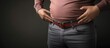 Man looking over his overweight stomach loosening worn out belt. Creative Banner. Copyspace image