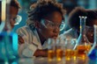 © banthita166 - African American children learn science through chemical experiments in school .