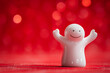 a small white figurine with a smile on his face is wa
