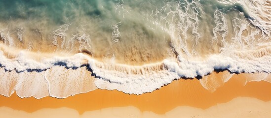 Wall Mural - Waves on the beach as a background. aerial view