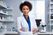 female scientist looking at camera in laboratory, woman wearing a labcoat