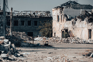 Wall Mural - destroyed houses in an abandoned city without people in Ukraine