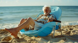Fototapeta Natura - portrait of an old man in a beach chair with his feet in the sand