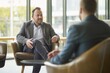 © Olga - Smiling men in business casual attire with glasses are engaged in a friendly conversation in a modern office setting