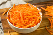 Leinwandbild Motiv Organic Raw Shredded Carrot Shreds