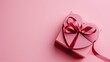 © StasySin - The image showcases a charming heart-shaped gift box in a deep, rich color, neatly tied with a glossy, satin ribbon that forms a bow on top. The box is placed against a soft pink backdrop that provide