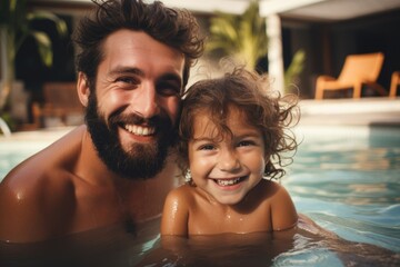 Wall Mural - Portrait of a young family swimming in the pool