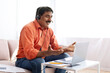 © Prostock-studio - Middle aged indian man attending online webinar from home