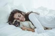A peaceful moment captured as a woman and her loyal companion nap together on a cozy bed, surrounded by the comforting embrace of their home