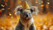a koala wearing a party hat with confetti on it's head and a party hat on its head.