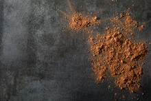 Cocoa Powder On Dark Tile Surface
