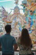 © cff999 - view from behind, a couple view the impresionant monument of las fallas festivity in Valencia