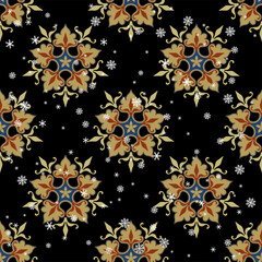 Wall Mural - Seamless winter pattern with beautiful five point mandalas and snowflakes. On black background.