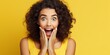 © Jafree - Shocked woman with hands on cheeks, open mouth, wide eyes. Concept of shock, unexpected news, pleasant sale or offer, joyful reaction, promotional content. Yellow backdrop. Wide banner with copy space