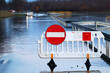 © FotoDax - Zamknięta droga zalana wodą z rzeki. Powódź.
