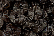 Close Up On Rolls Of Licorice Piled For Display.