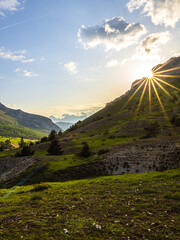 Wall Mural - Afternoon sunrays in the alpine valley