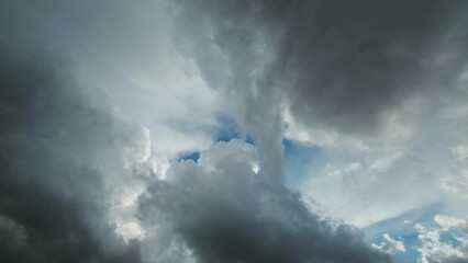 Wall Mural - Dark storm clouds moving and the hole with a piece of blue sky, timelapse 4k