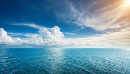 Wall Mural - blue sea or ocean with sunny and cloudy sky