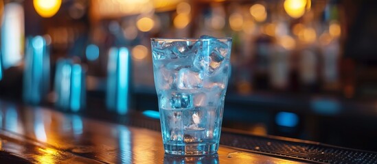 Refreshing glass of pure water on a stylish bar counter with modern ambiance