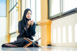 © maya1313 - Ramadan, The image of an Asian Muslim woman in the Islamic religion in hijab in black color. reading the Quran and having a happy smiling face Staying in a beautiful mosque out of respect for God.
