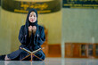 © maya1313 - Ramadan, The image of an Asian Muslim woman in the Islamic religion in hijab in black color. reading the Quran and having a happy smiling face Staying in a beautiful mosque out of respect for God.