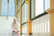 © maya1313 - Ramadan, quran, The image of an Asian Muslim woman in the Islamic religion in hijab in cream color. reading the Quran and having a happy Staying in a beautiful mosque, Arabic word Holy Al Quran.