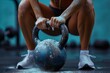 The dynamic action of an athlete lifting a chalk-covered kettlebell highlights strength and endurance
