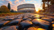 Colosseum during a quiet moment at sunset in Rome Italy, low angle view of Colosseum