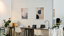 No People Shot Of Interior Of Workspace In Modern Office Equipped With Minimalistic Furniture And Decorated With Abstract Paintings, Copy Space