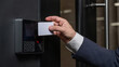 A man opens the door with a card. Modern electronic lock. Keyless Entry