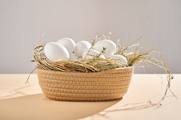 Wall Mural - Wicker basket with farm natural white eggs.