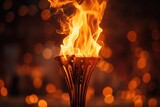 Fototapeta  - Burning torch on a black background, close-up, fire Olympic flame, Ai generated