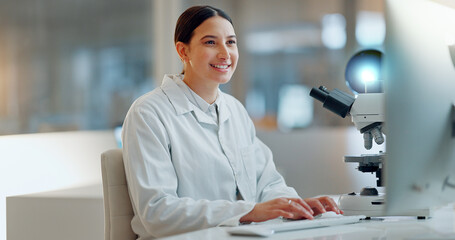 Wall Mural - Science, research and happy woman with computer, typing and biotech data report in laboratory. Medical innovation, scientist or lab technician in study in healthcare, medicine or online test feedback