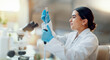 © SneakyPeakPoints/peopleimages.com - Science, laboratory and woman with pipette, test tube and biotech solution in research. Medical innovation, scientist or lab technician in study for healthcare, medicine and vaccine results feedback.