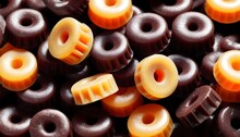 Licorice Wheels Candies Background, Some Black, Some Yellow
