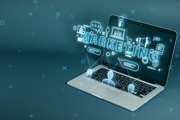 Wall Mural - Close up of laptop with creative marketing hologram with various icons on blurry background. Seo, media and analytics concept. 3D Rendering.