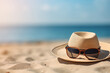 hat and sunglass on beach close up. summer background