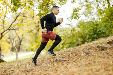 Wall Mural - A fast runner is running up to the stairs in nature.