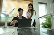 © Prathankarnpap - Two colleagues working on sustainable innovation project at office. Green energy development concept