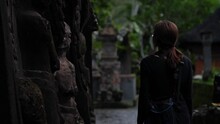 High Definition Slow Motion Footage Of Woman Walking Along Carved Wall In Ancient Balinese Temple, Bali, Indonesia.
Medium Angle, Parallax Movement.