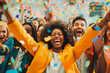 © VisualProduction - Happy diverse business team celebrating success and having fun all together with confetti falling around them.