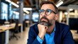 © BetterPhoto - Portrait of a thoughtful business man in the office.